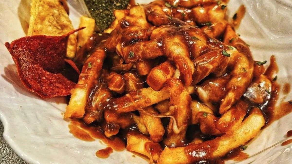 Poutine with fries, Bothwell cheese curds and gravy at Pregame Sports Bar & Lounge, St. Boniface, Winnipeg