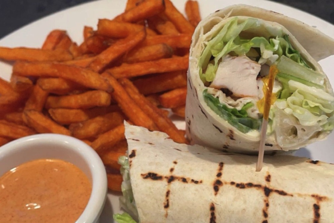 Chicken Caesar Wrap with romaine and Caesar dressing in a grilled flour tortilla at Pregame Sports Bar & Lounge, Winnipeg